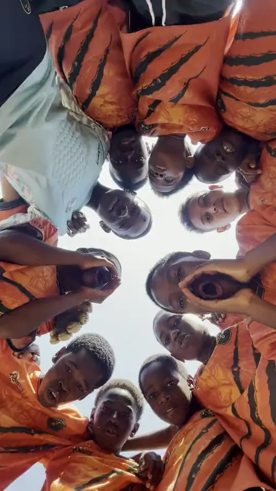 The real Kopa Lions in their orange kit, playing and coming together as a team in Ndola